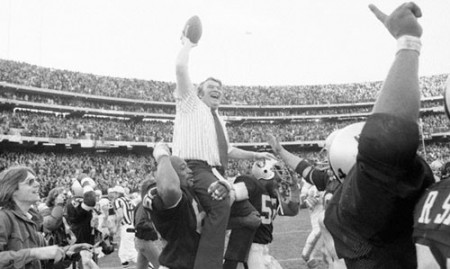 John Madden Holding the Ball High